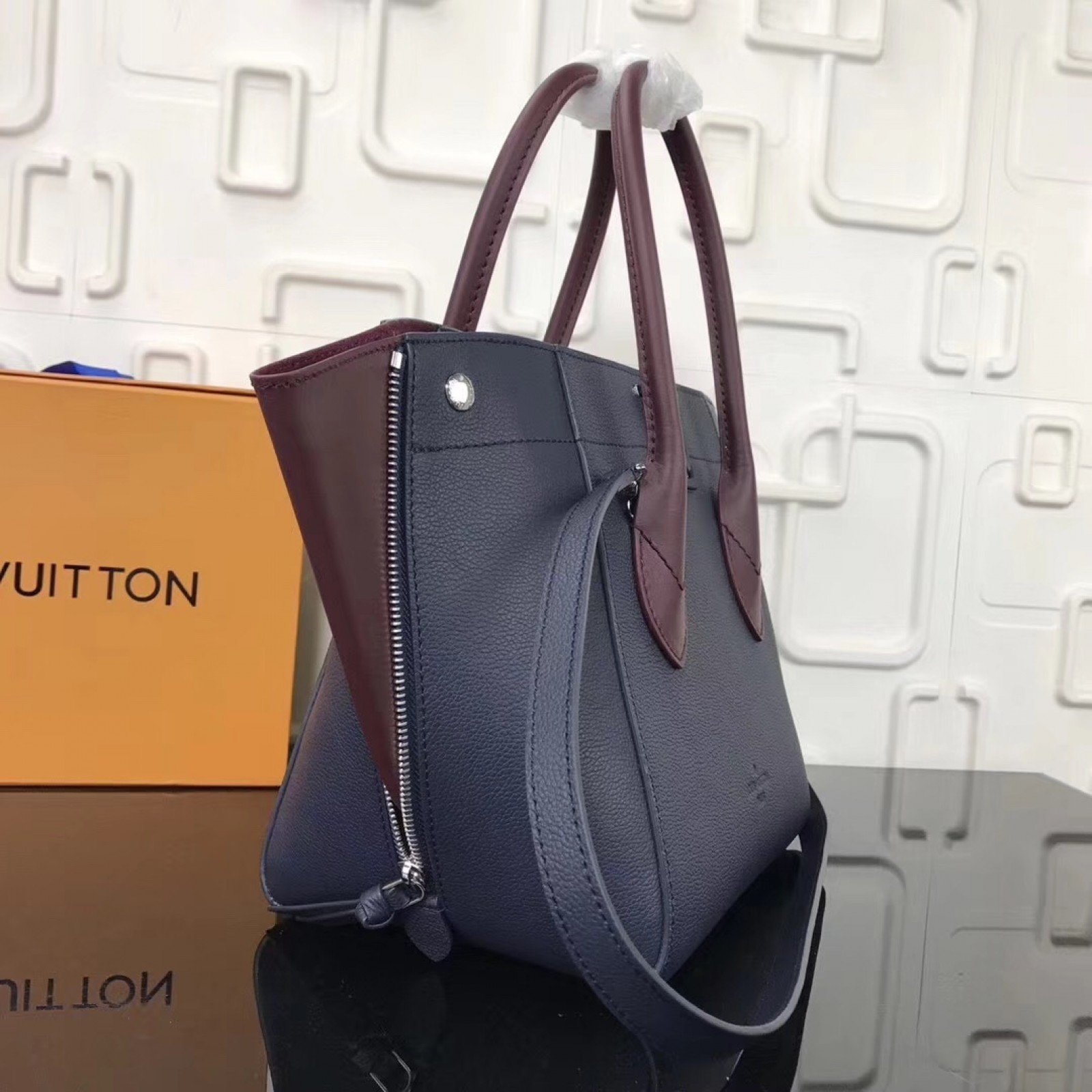 LV FREEDOM Handbag M54843