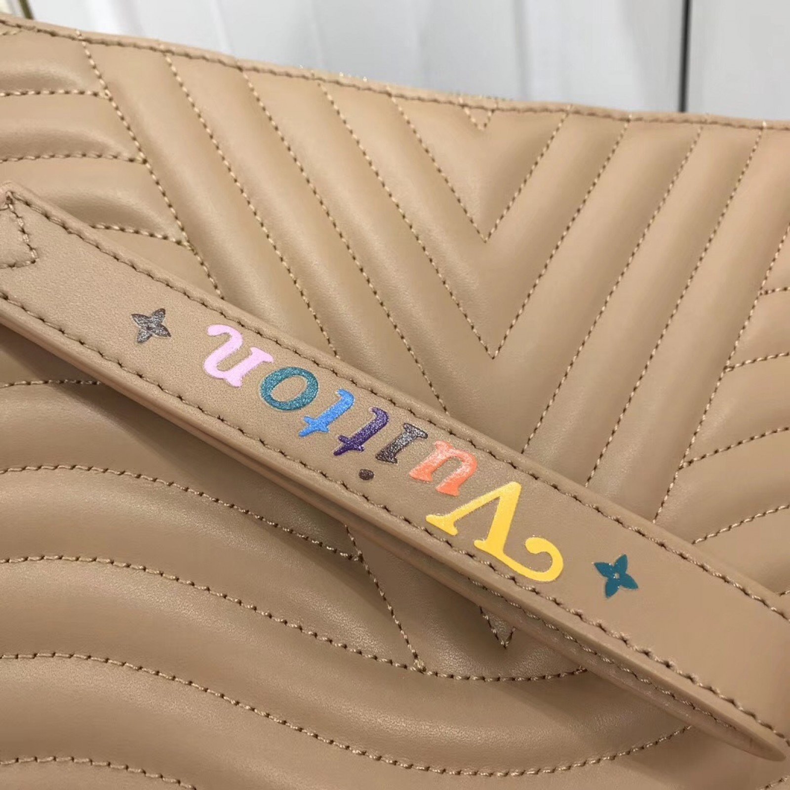 LV NEW WAVE ZIP POCHETTE M63943