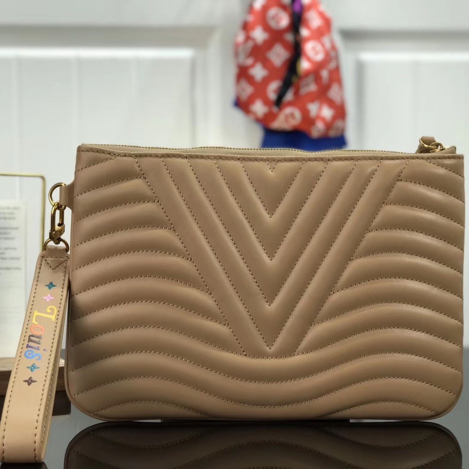 LV NEW WAVE ZIP POCHETTE M63943