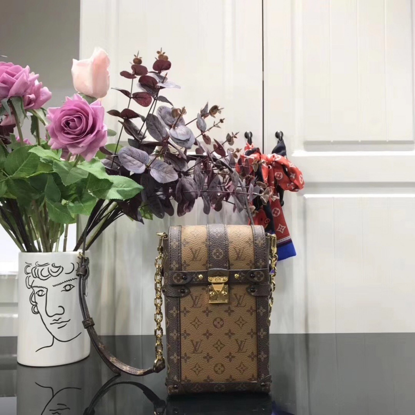 LV VERTICAL TRUNK POCHETTE M63913