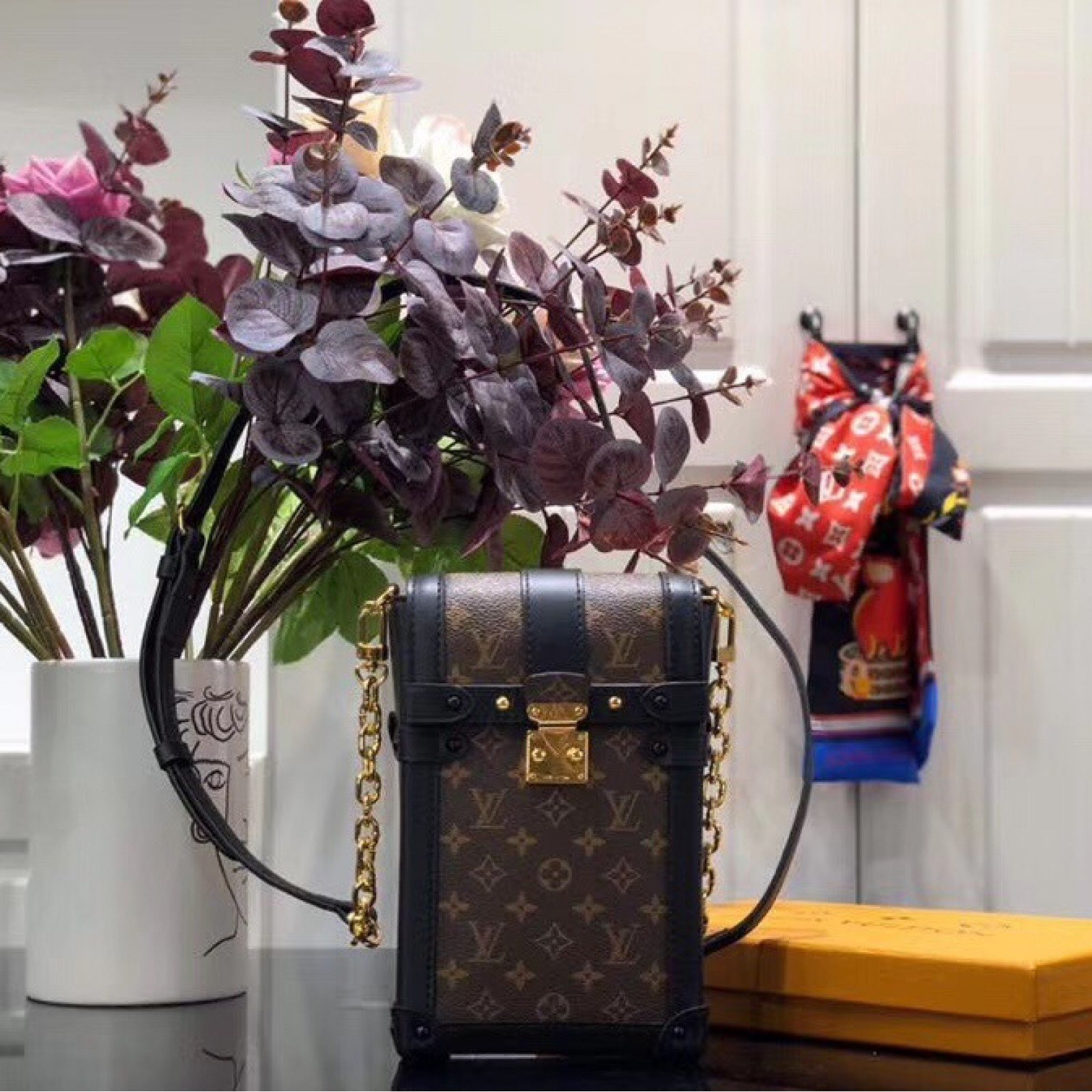 LV VERTICAL TRUNK POCHETTE M63913
