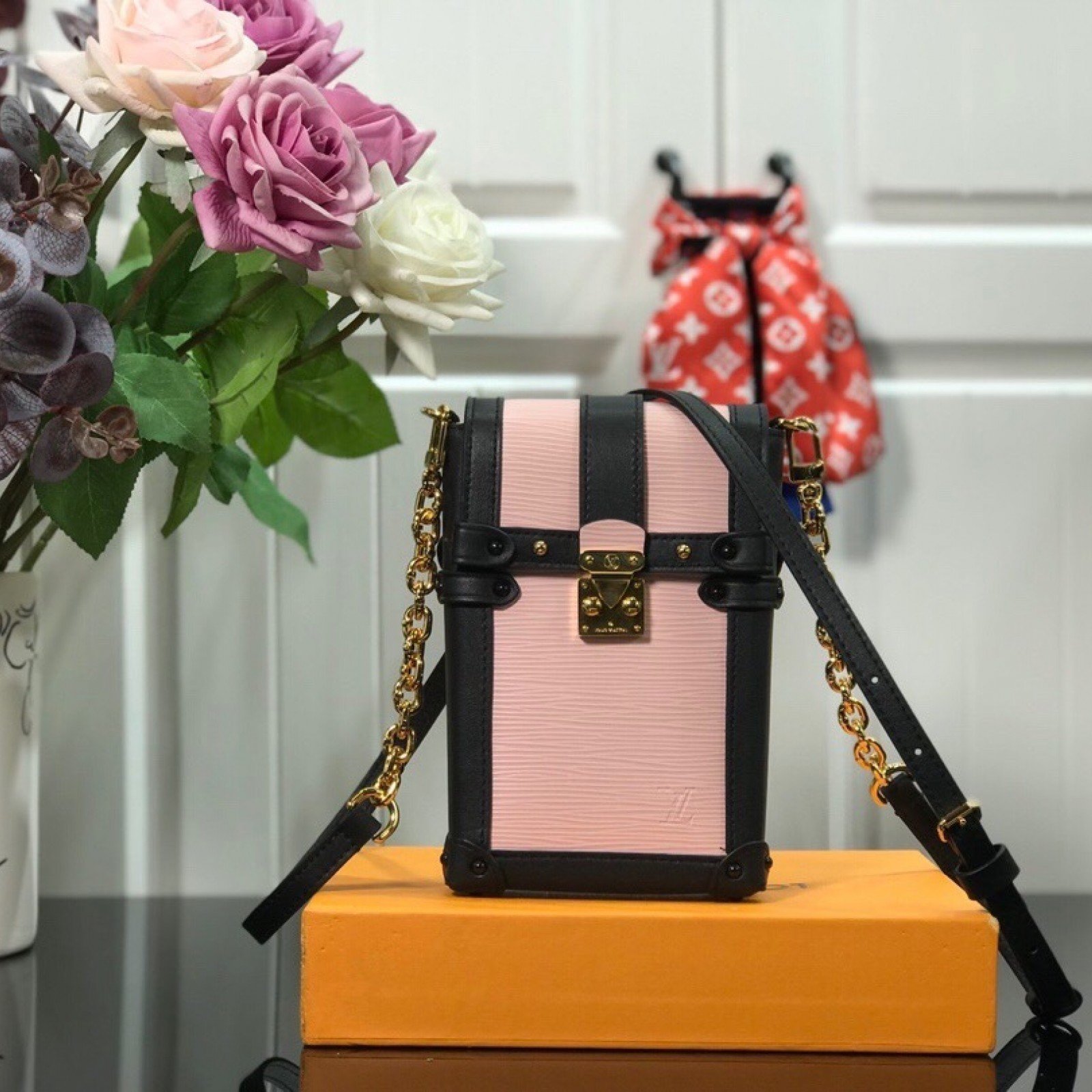 LV VERTICAL TRUNK POCHETTE M67872