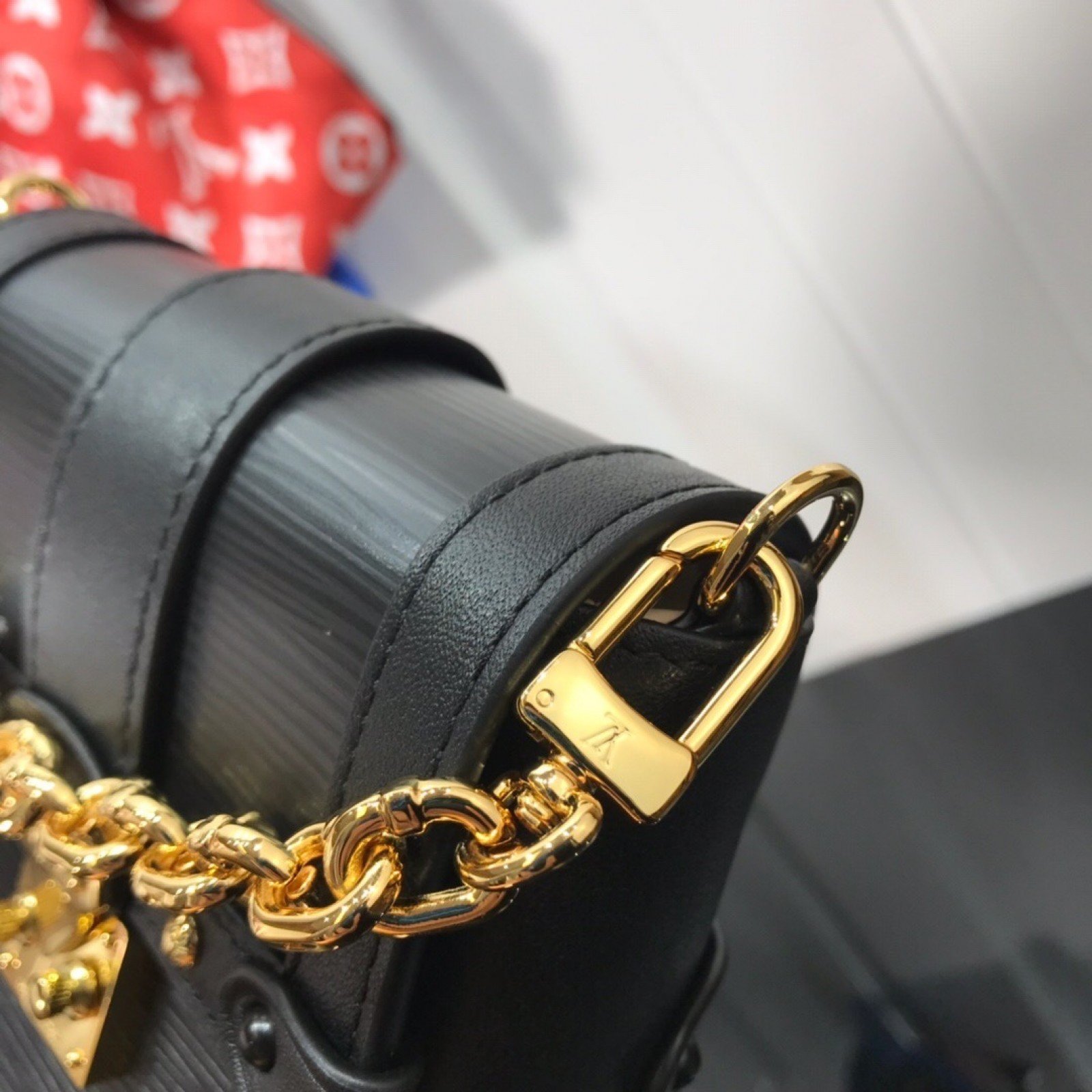 LV VERTICAL TRUNK POCHETTE M67872