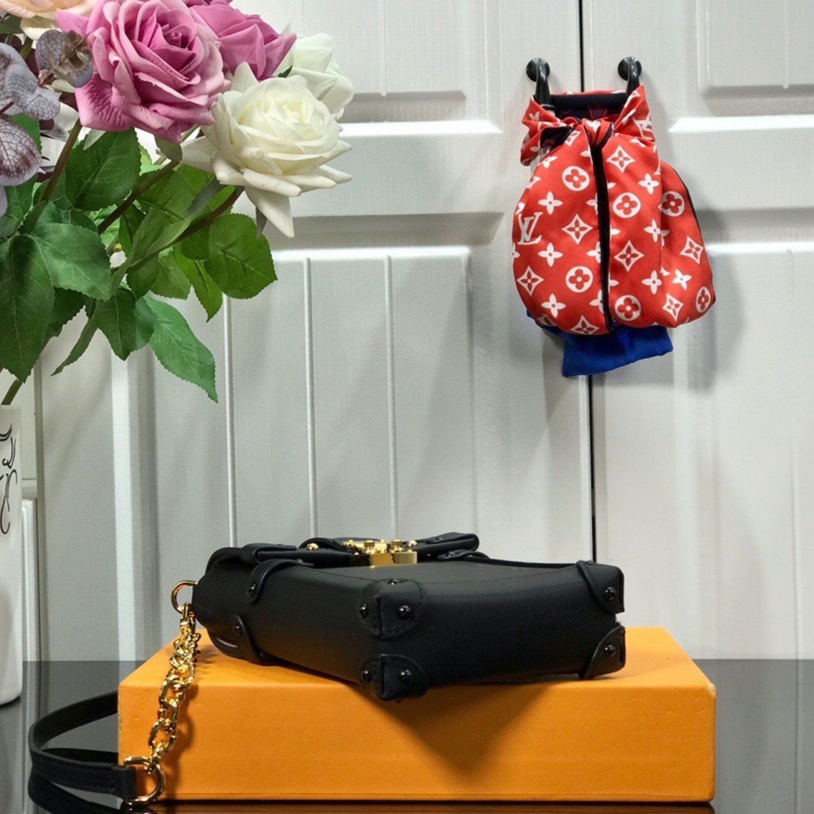LV VERTICAL TRUNK POCHETTE M67872